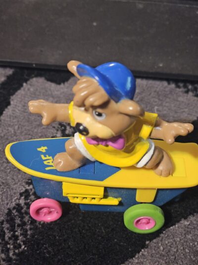 Vintage Skateboarding Bear Toy with Colorful Wheels - product image 1