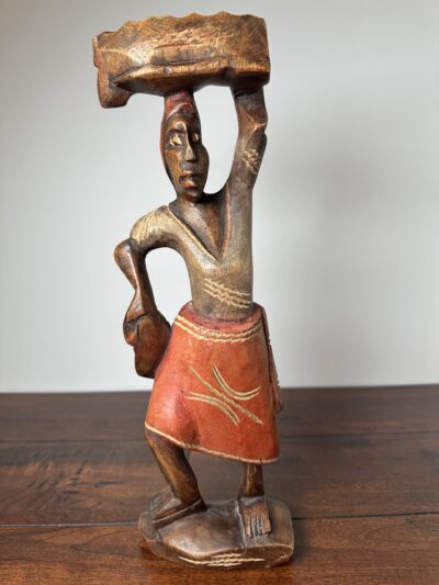 Hand-Carved Wooden Sculpture of Figure in Red Skirt - product image 1