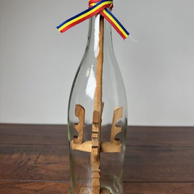 Unique Decorative Ship in a Bottle with Wooden Sculptures - product image 1