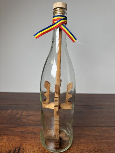 Unique Decorative Ship in a Bottle with Wooden Sculptures - product image 1