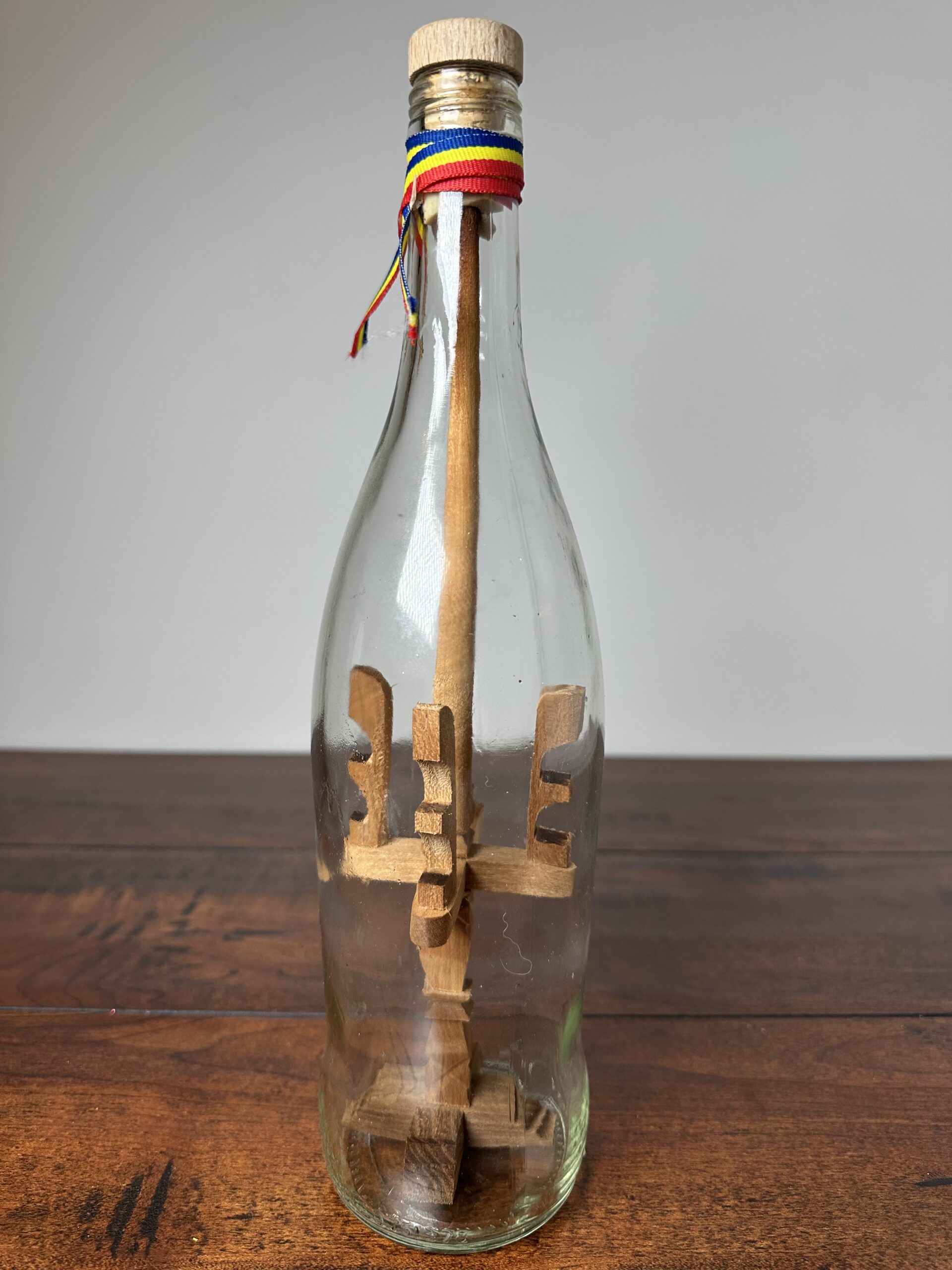 Unique Decorative Ship in a Bottle with Wooden Sculptures - product image 2