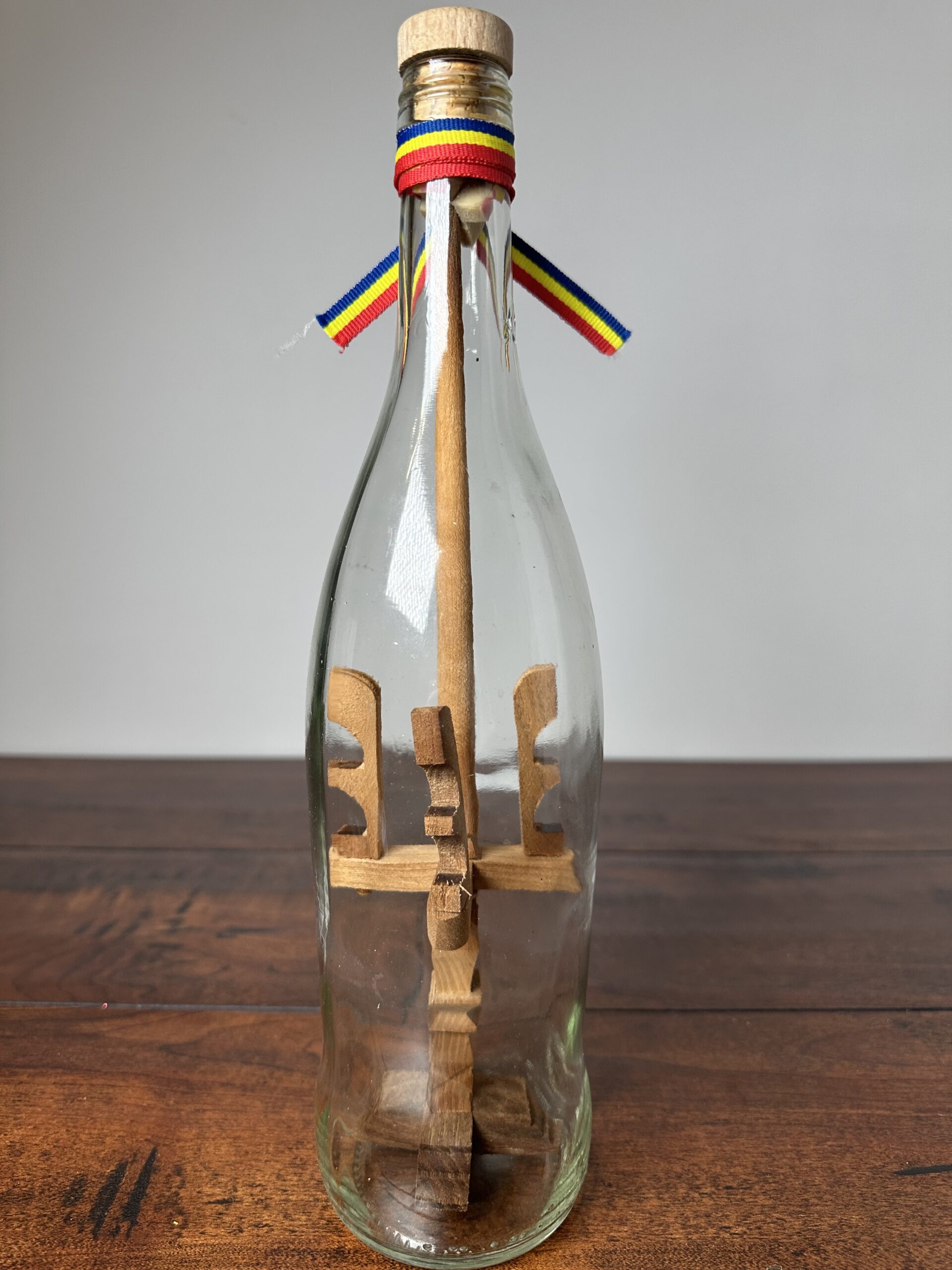 Unique Decorative Ship in a Bottle with Wooden Sculptures - product image 3