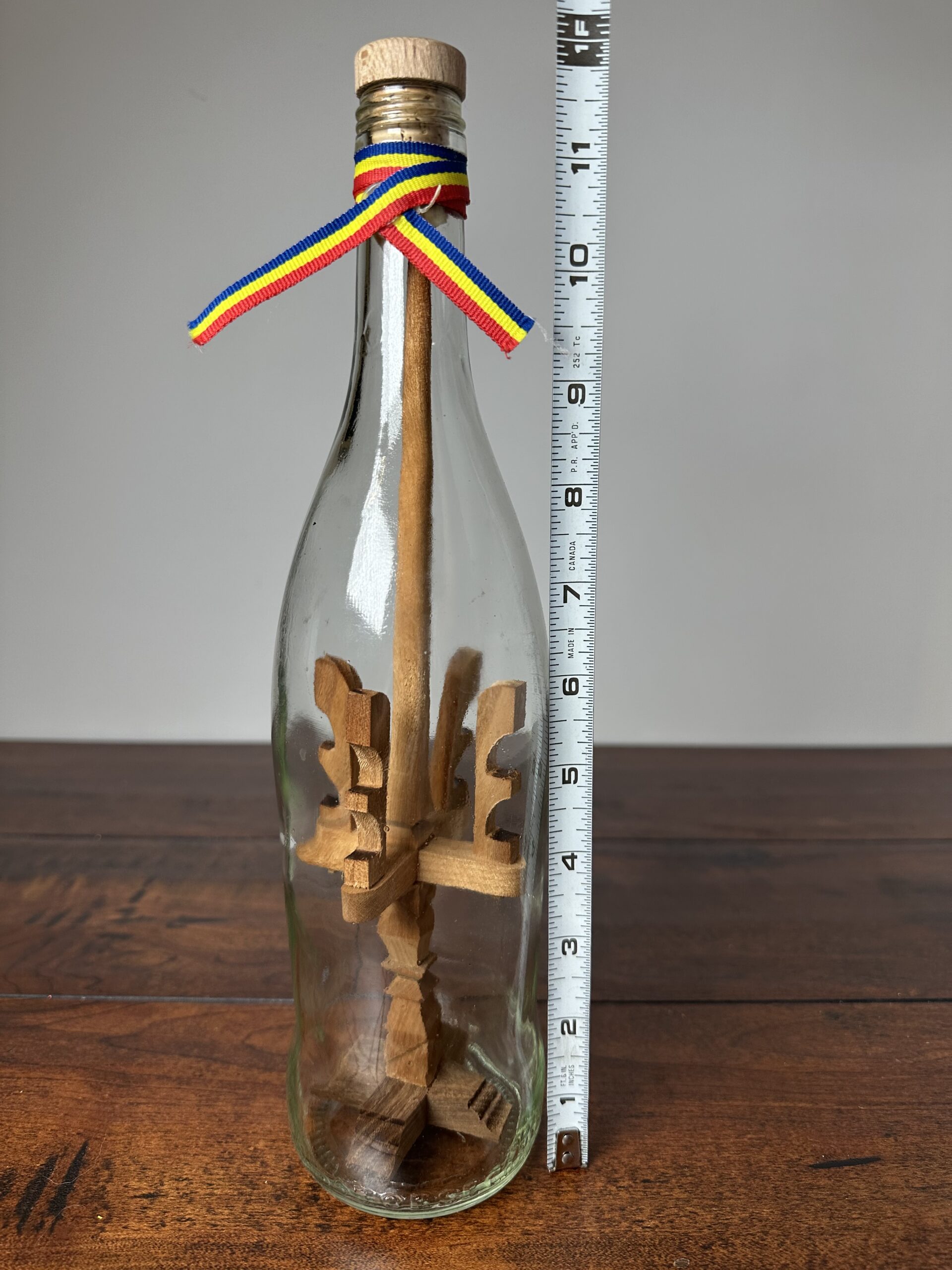 Unique Decorative Ship in a Bottle with Wooden Sculptures - product image 5