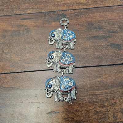 Handcrafted Metal Elephant Wall Hanging Decor with Blue Accents - product image 1
