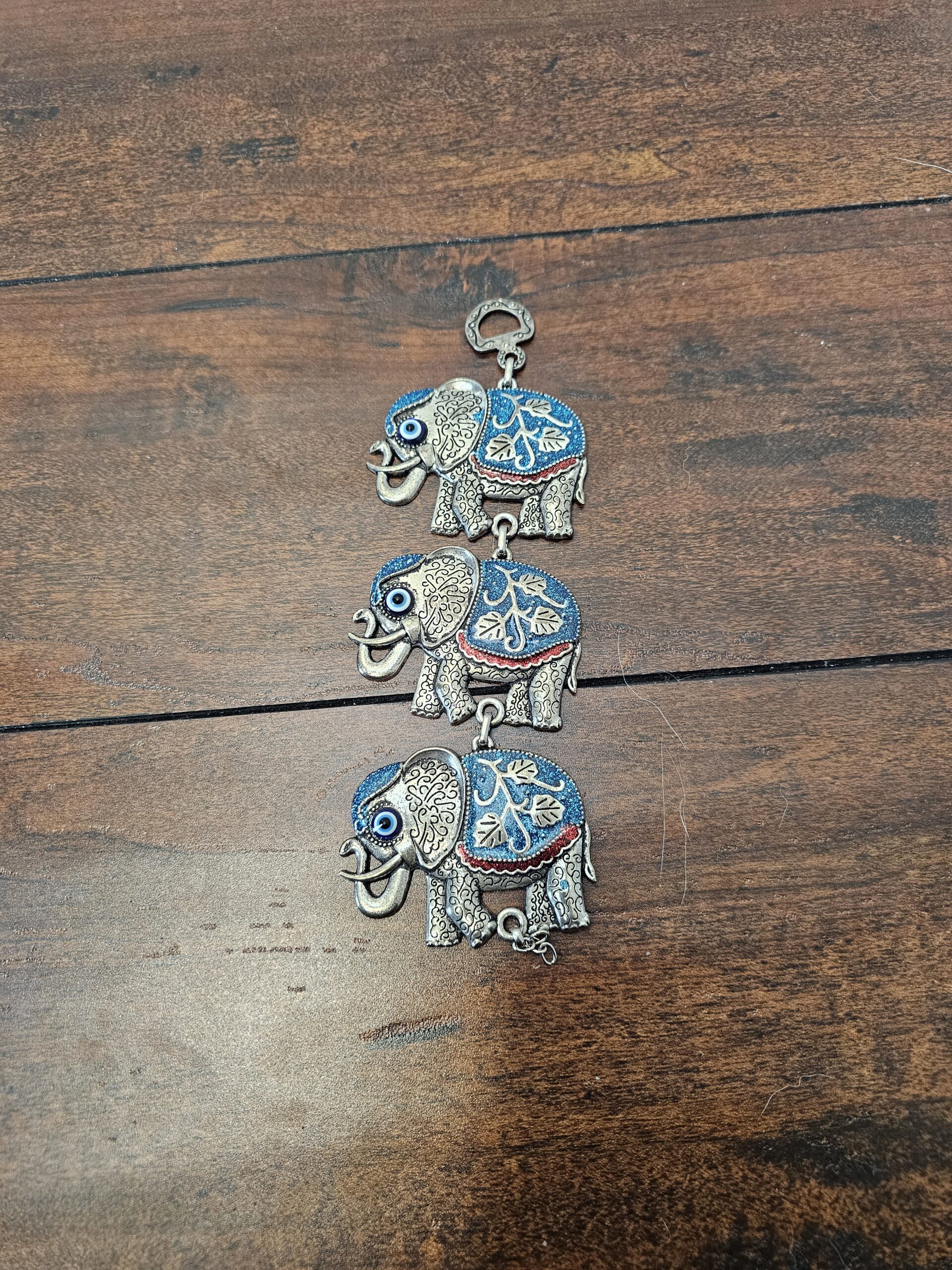 Handcrafted Metal Elephant Wall Hanging Decor with Blue Accents - product image 1