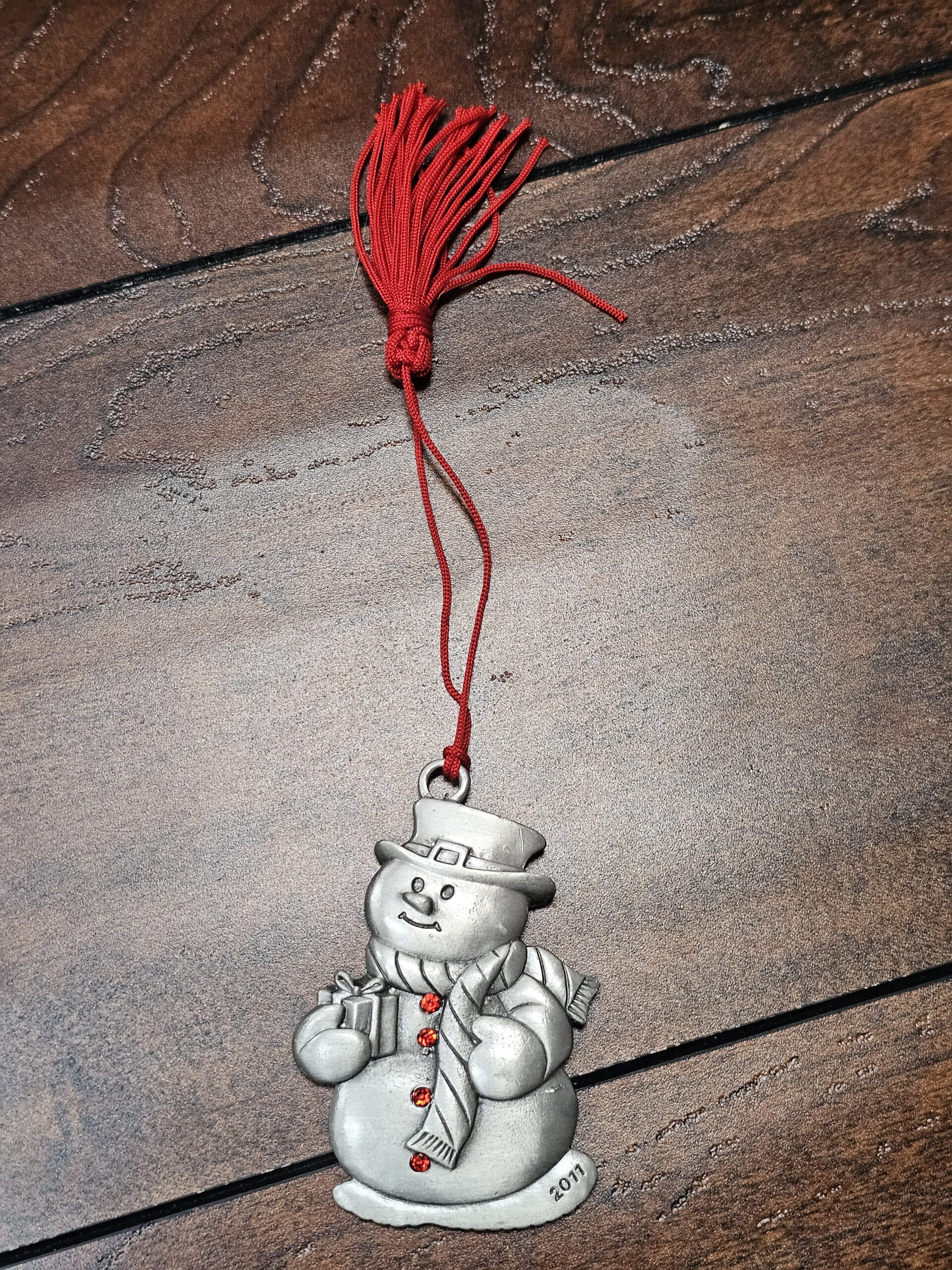 Pewter Snowman Ornament with Red Tassel Holiday Decoration - product image 1
