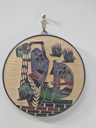 Round Wooden Wall Art with Carved Figures - product image 1