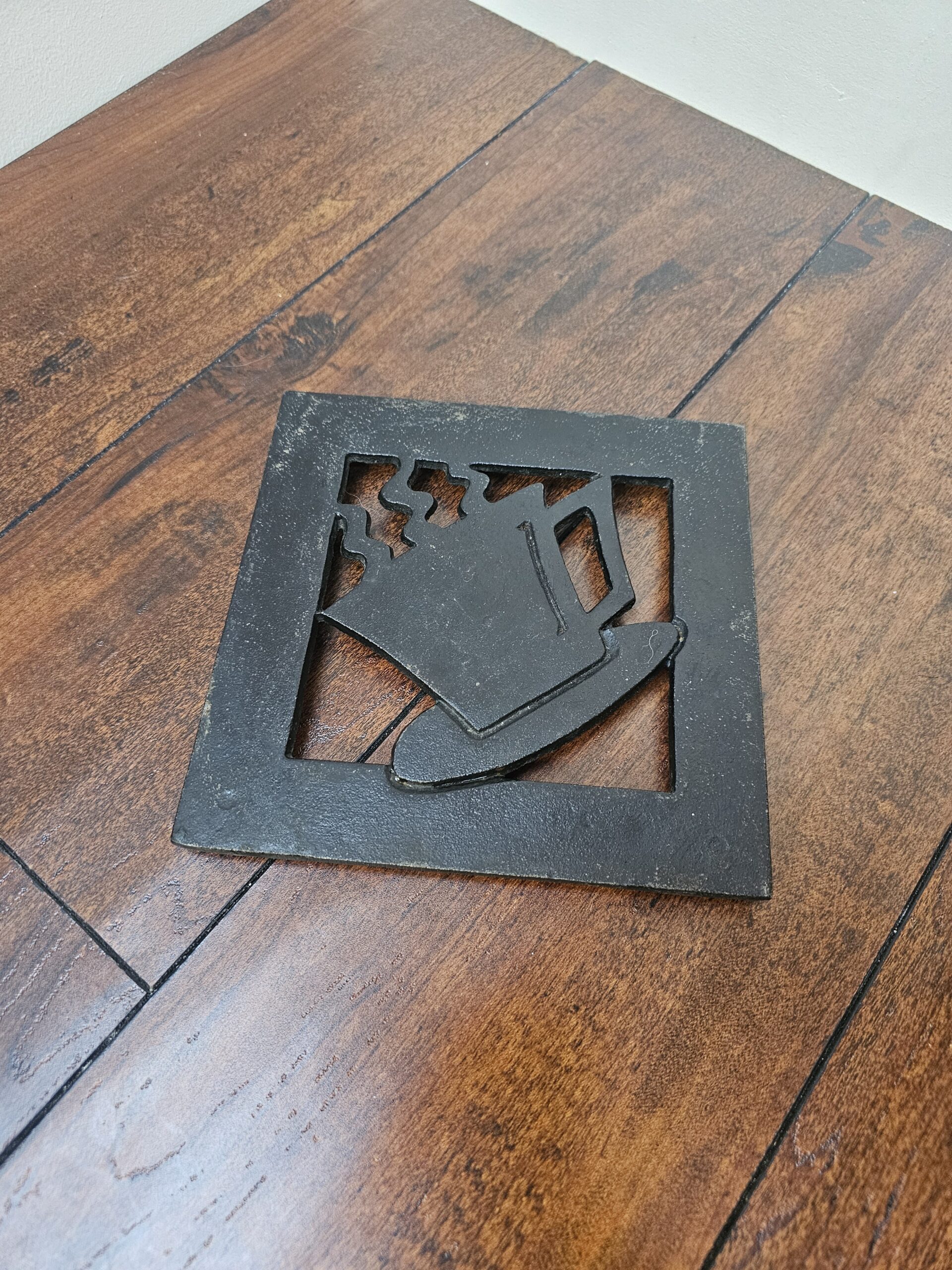 Hudson's Bay Company Cast Iron Trivet with Coffee Cup Design - product image 1